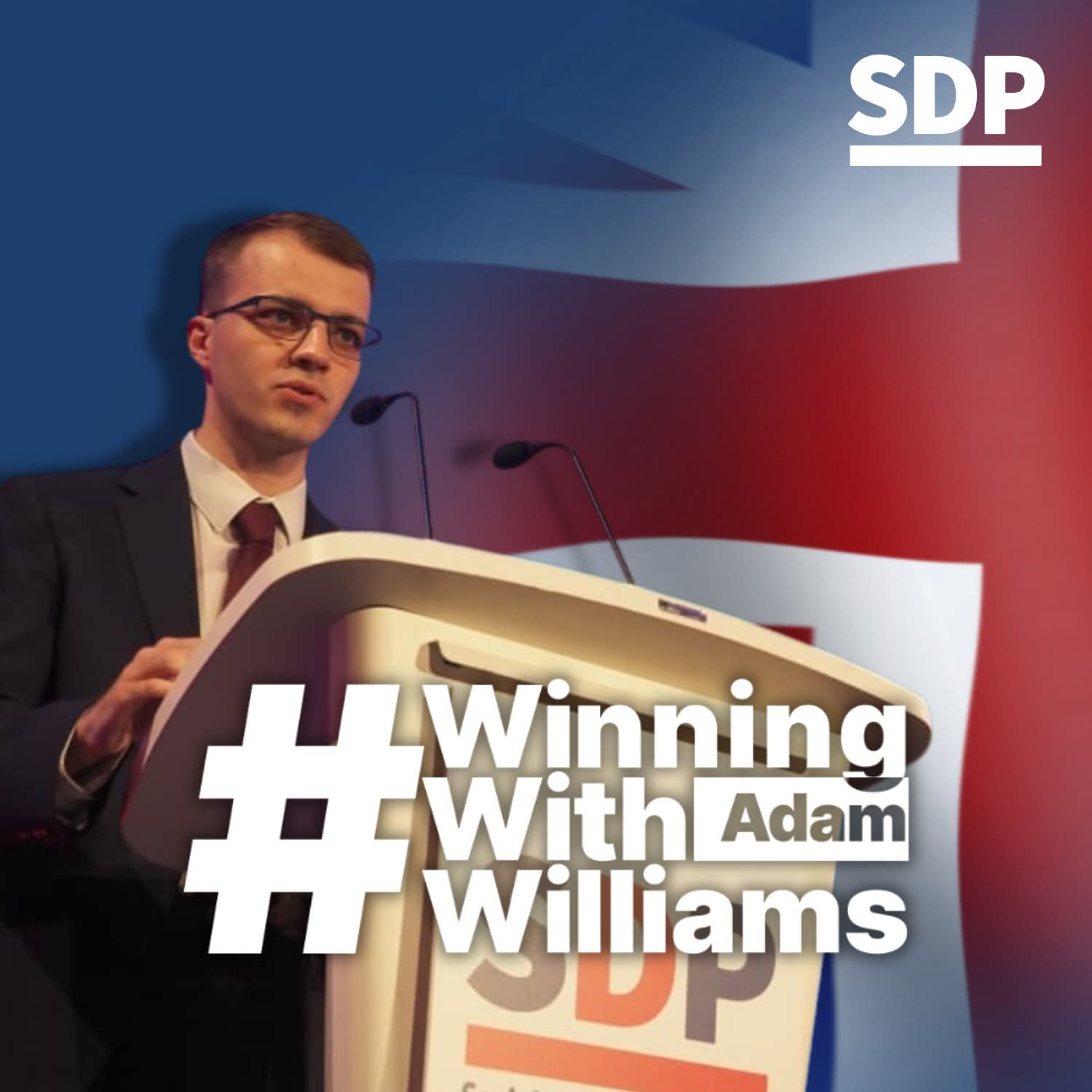 Adam Williams speaking at an SDP conference, with Winning With Williams campaign branding